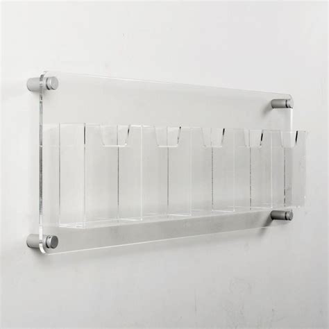 plexiglass holders mounted on wall